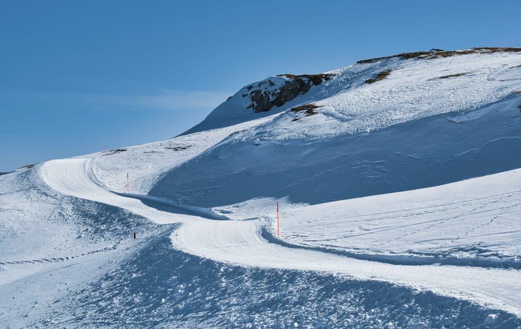 Icy and uneven ski slope conditions increasing winter sports injury risks